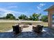 Paver patio with fire pit and comfortable seating, perfect for outdoor relaxation at 607 Vintage Way, Brandon, FL 33511