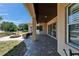 Covered back patio with ceiling fan, and comfortable seating area at 607 Vintage Way, Brandon, FL 33511