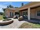 Paver patio featuring comfortable seating and a cozy outdoor firepit at 607 Vintage Way, Brandon, FL 33511