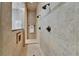 Detailed walk-in shower features dual shower heads and tile surround at 607 Vintage Way, Brandon, FL 33511