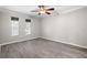 Bright bedroom with a ceiling fan and large windows allowing ample natural light at 716 Lyndhurst St # 702, Dunedin, FL 34698