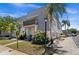 Charming two-story condo with a beautiful lawn, mature landscaping, and a second story balcony at 716 Lyndhurst St # 702, Dunedin, FL 34698