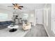 Inviting living room with a ceiling fan, modern furniture, and lots of natural light at 716 Lyndhurst St # 702, Dunedin, FL 34698
