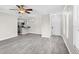 Bright living room with a ceiling fan, lots of open space, and an entryway to the kitchen at 716 Lyndhurst St # 702, Dunedin, FL 34698