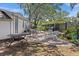 Outdoor patio offers multiple seating areas and lush landscaping at 716 Lyndhurst St # 702, Dunedin, FL 34698