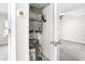 Compact utility closet housing the water heater and HVAC system at 716 Lyndhurst St # 702, Dunedin, FL 34698