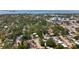 Overhead view shows a community nestled amongst tree cover, with diverse single Gathering homes at 809 Scotland St, Dunedin, FL 34698