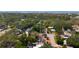 Overhead shot showcases a neighborhood with a home with solar panels, near the ocean at 809 Scotland St, Dunedin, FL 34698