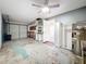 Spacious garage featuring overhead lighting, storage space, and an unfinished floor and walls at 809 Scotland St, Dunedin, FL 34698