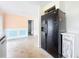 Additional view of the kitchen featuring a refrigerator and a section of floor at 809 Scotland St, Dunedin, FL 34698