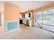 Open concept kitchen with an adjoining lanai through sliding glass doors at 809 Scotland St, Dunedin, FL 34698