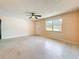 Open concept living room with large window and exterior door at 809 Scotland St, Dunedin, FL 34698