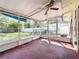 Spacious sunroom with screened walls, offering seamless indoor-outdoor living at 809 Scotland St, Dunedin, FL 34698