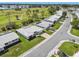 Scenic aerial shot showcases a neat neighborhood with lush golf course views and well-kept lawns at 10036 40Th N St # 3, Pinellas Park, FL 33782