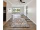 Entryway showcasing wood-look floors, leading to the bright living spaces, and kitchen at 10036 40Th N St # 3, Pinellas Park, FL 33782