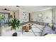 Bright living room featuring stylish decor, wood-look floors, and a cozy seating arrangement at 10036 40Th N St # 3, Pinellas Park, FL 33782