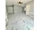 Spacious bedroom with gray walls, white trim, and modern marble pattern flooring throughout at 1318 W Broad St, Tampa, FL 33604