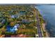 Scenic aerial view of a coastal community with waterfront homes and a beautiful bay at 147 & 139 Edgewater Dr, Dunedin, FL 34698