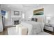 Bright bedroom featuring a fireplace, art, and cozy seating at 147 & 139 Edgewater Dr, Dunedin, FL 34698