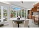 Bright dining area features tile floors, and large windows that provide views of the outdoors at 147 & 139 Edgewater Dr, Dunedin, FL 34698