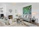 Comfortable living area showcasing modern decor, a fireplace, and ample natural light for relaxation at 147 & 139 Edgewater Dr, Dunedin, FL 34698