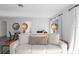 Comfortable living room with a large sofa and stylish decor elements at 147 & 139 Edgewater Dr, Dunedin, FL 34698