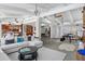 Spacious living room with an open layout, modern decor, and views to the kitchen and office at 147 & 139 Edgewater Dr, Dunedin, FL 34698