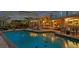 Backyard pool, patio, and gazebo with outdoor dining and seating create an entertainer's paradise at 147 & 139 Edgewater Dr, Dunedin, FL 34698