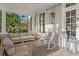 Inviting front porch with comfortable seating, stylish décor, and relaxing ambiance, creating a perfect outdoor retreat at 147 & 139 Edgewater Dr, Dunedin, FL 34698