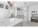 Bright walk-in closet featuring an island, vanity, and mirrored cabinets at 147 & 139 Edgewater Dr, Dunedin, FL 34698