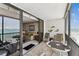 Balcony view opens into living room with beach and ocean views at 15462 Gulf Blvd # 504, Madeira Beach, FL 33708