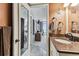 A bathroom with a granite countertop and views of the bedroom and the ocean view from the bedroom at 15462 Gulf Blvd # 504, Madeira Beach, FL 33708