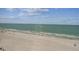 Clear view of the beach and ocean through a screened window at 15462 Gulf Blvd # 504, Madeira Beach, FL 33708