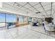 Spacious dining area with tile floors, ocean views, and comfortable seating arrangement at 15462 Gulf Blvd # 504, Madeira Beach, FL 33708