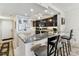 Breakfast bar in this lovely kitchen features granite countertops and barstool seating at 15462 Gulf Blvd # 504, Madeira Beach, FL 33708