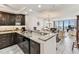 Open-concept kitchen featuring granite countertops, stainless steel appliances, and modern finishes at 15462 Gulf Blvd # 504, Madeira Beach, FL 33708