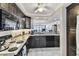 Open-concept kitchen with granite counters, stainless steel appliances, and direct views of the balcony at 15462 Gulf Blvd # 504, Madeira Beach, FL 33708