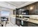 Convenient kitchen with laundry area, great appliances and ample cabinetry at 15462 Gulf Blvd # 504, Madeira Beach, FL 33708