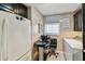 Bright laundry area with compact desk space and storage adjacent to the main kitchen at 15462 Gulf Blvd # 504, Madeira Beach, FL 33708