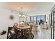 Open living and dining area boasts ample space with large windows and a view of the ocean at 15462 Gulf Blvd # 504, Madeira Beach, FL 33708