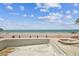 View of the beach over unfinished in-ground pool at 15462 Gulf Blvd # 504, Madeira Beach, FL 33708