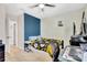 The bedroom features a vibrant blue accent wall and a sporty, cozy Steelers theme at 16149 Tuscany Hillside Rd, Odessa, FL 33556