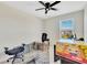 This bedroom features a ceiling fan, a window, and plenty of empty space at 16149 Tuscany Hillside Rd, Odessa, FL 33556