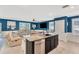 Open-concept living room featuring an island, tile flooring, recessed lighting, and relaxing furniture at 16149 Tuscany Hillside Rd, Odessa, FL 33556