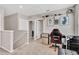 Upstairs loft area perfect for a game or play area, with a mini fridge and shelving at 16149 Tuscany Hillside Rd, Odessa, FL 33556