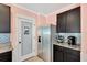 Kitchen featuring stainless steel refrigerator, modern cabinetry, subway tile backsplash, and walk-in pantry at 16149 Tuscany Hillside Rd, Odessa, FL 33556