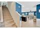 View of carpeted staircase in a home with adjacent kitchen and living spaces at 16149 Tuscany Hillside Rd, Odessa, FL 33556