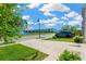Nice street view with a pond and fountain, well-manicured green lawns, sidewalks and a parked SUV at 16149 Tuscany Hillside Rd, Odessa, FL 33556