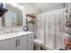 Bathroom featuring a white vanity, decorative shower curtain, and functional layout at 186 Grand Ave, Brooksville, FL 34604