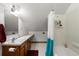 A view of the bathroom with a shower and white tile at 1905 Mckinley St, Clearwater, FL 33765